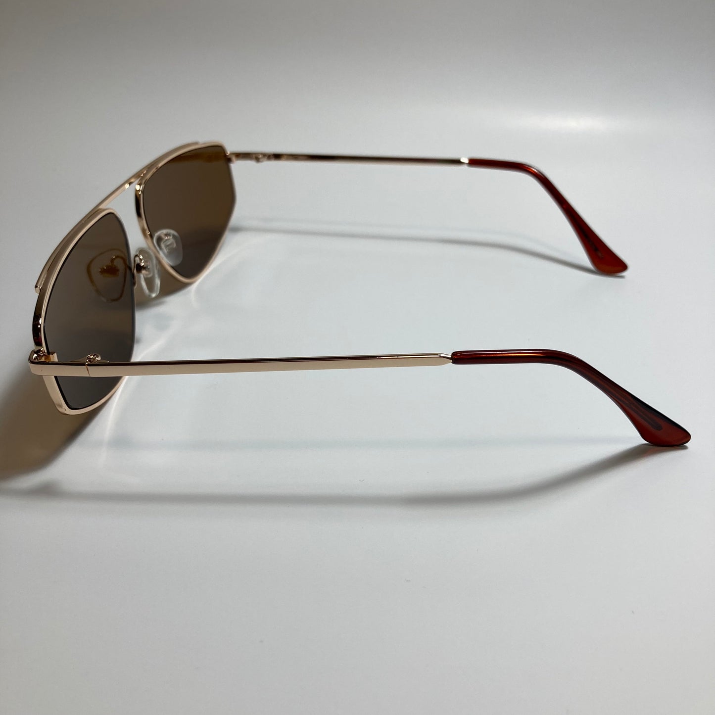 mens and womens brown and gold futuristic sunglasses