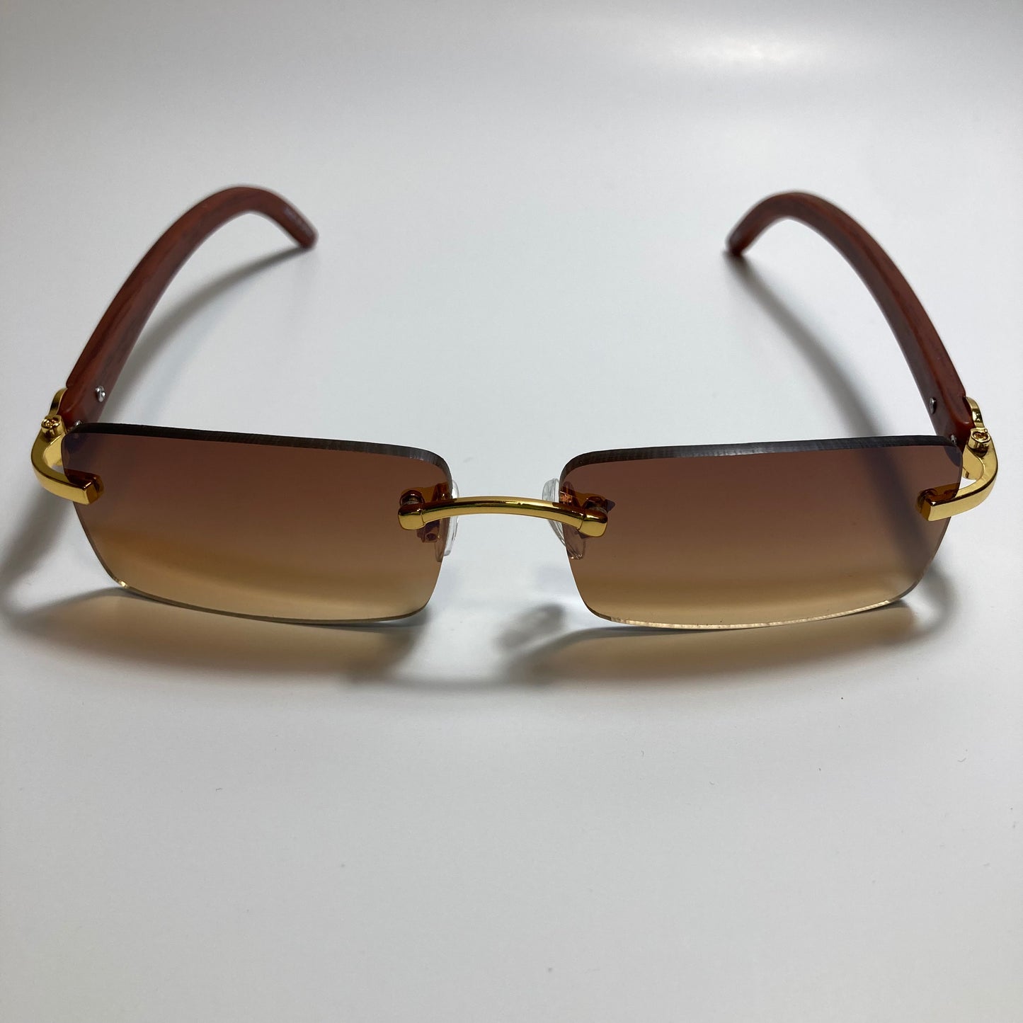mens and womens brown rimless square sunglasses
