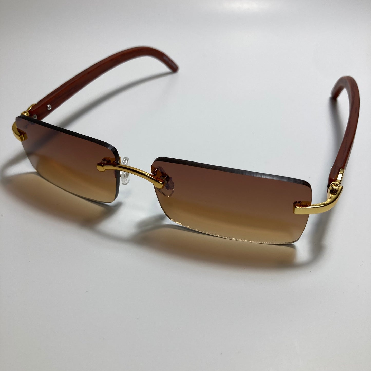mens and womens brown rimless square sunglasses