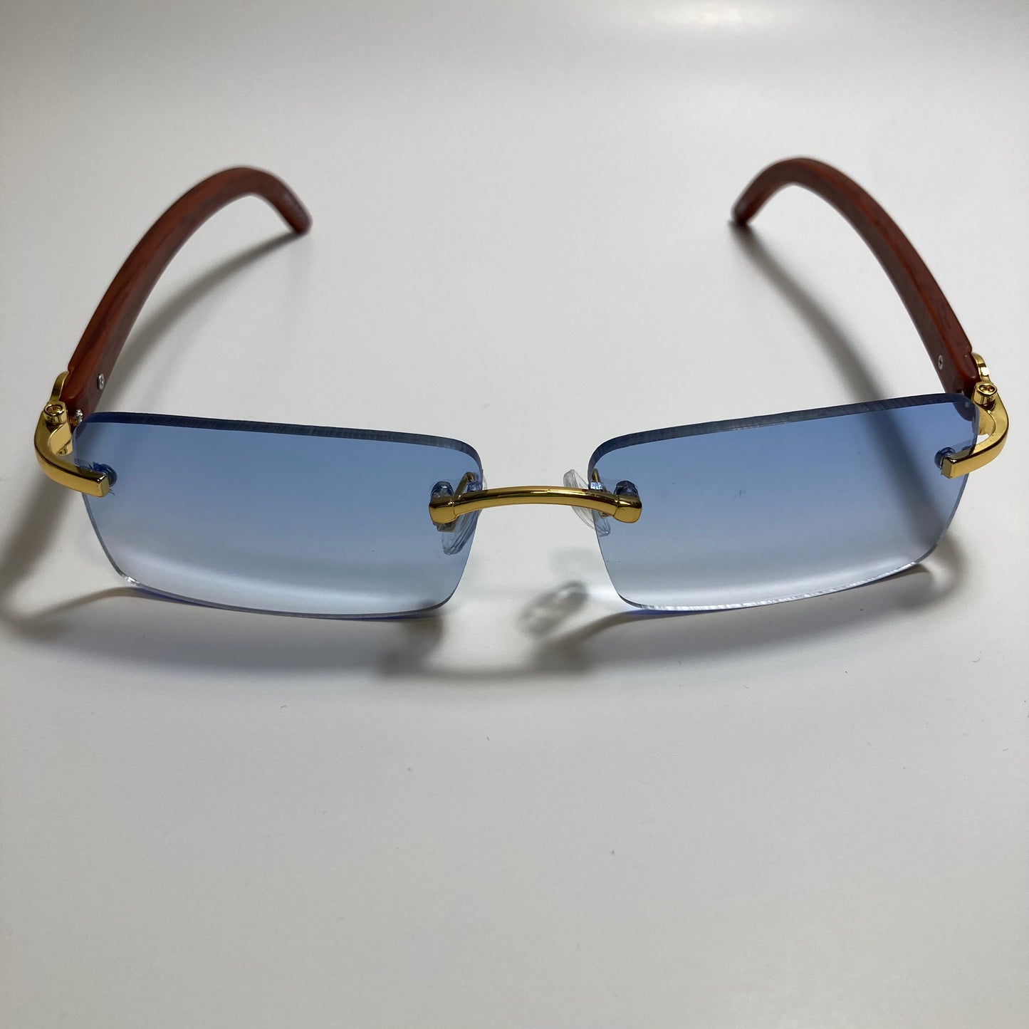mens and womens blue rimless square sunglasses