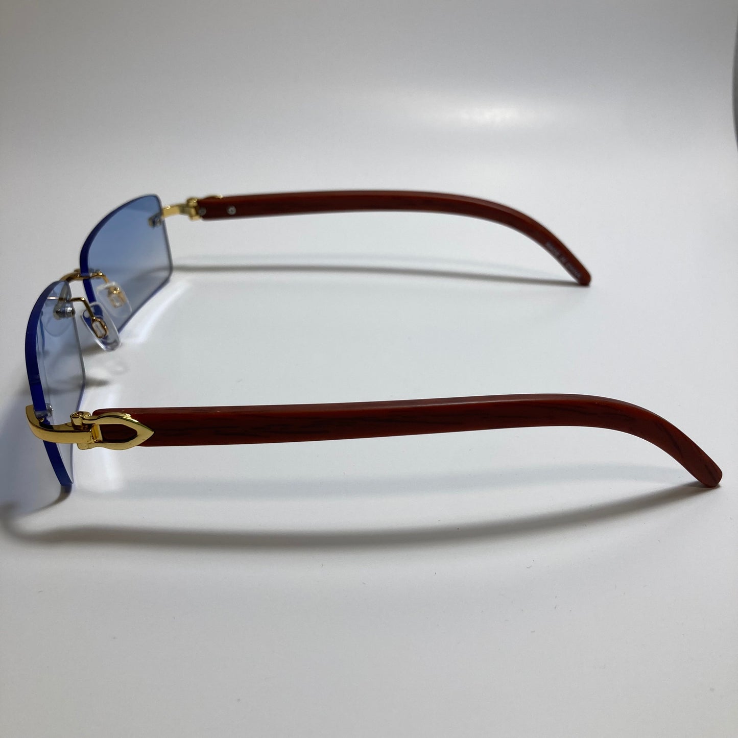 mens and womens blue rimless square sunglasses