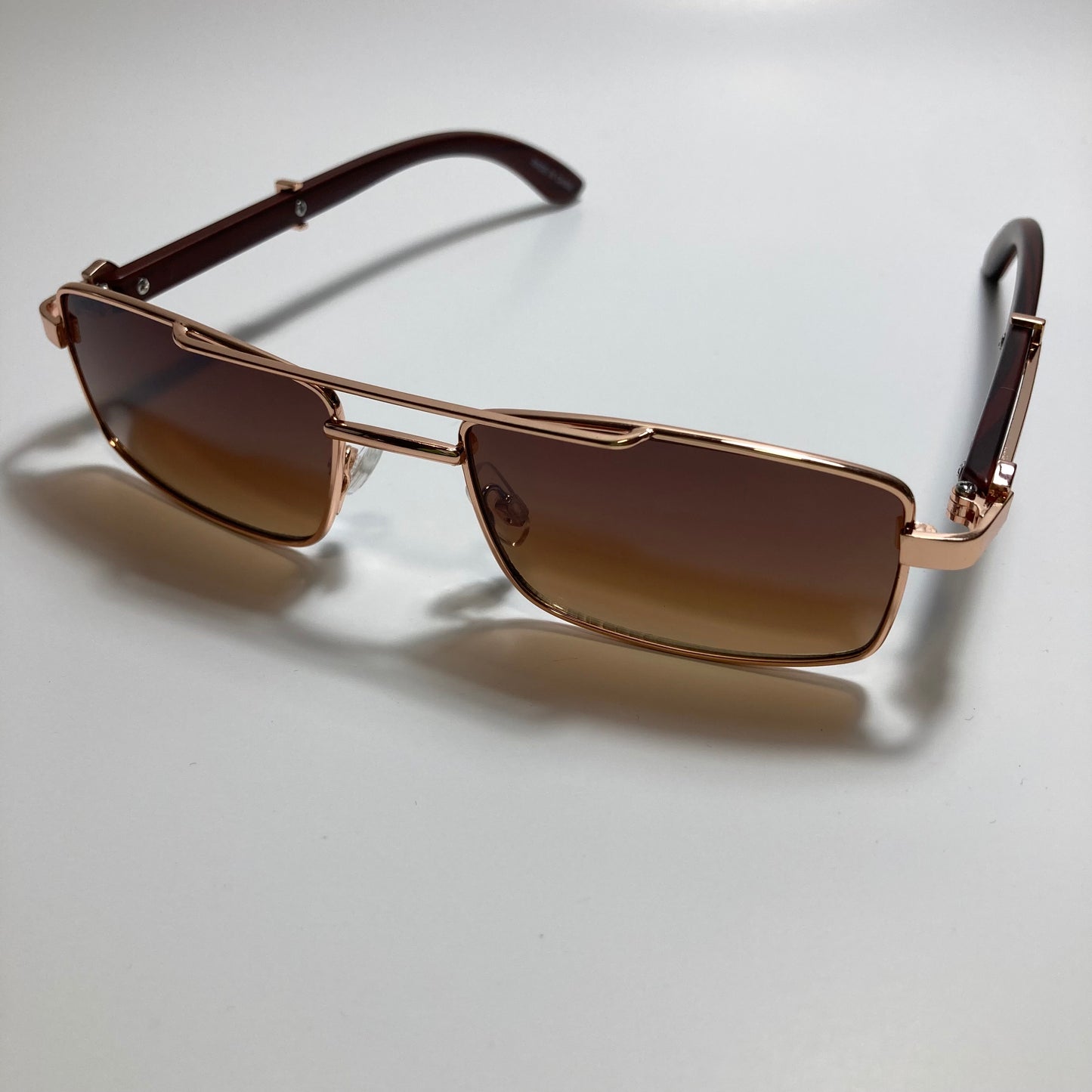 womens and mens brown and gold square metal sunglasses