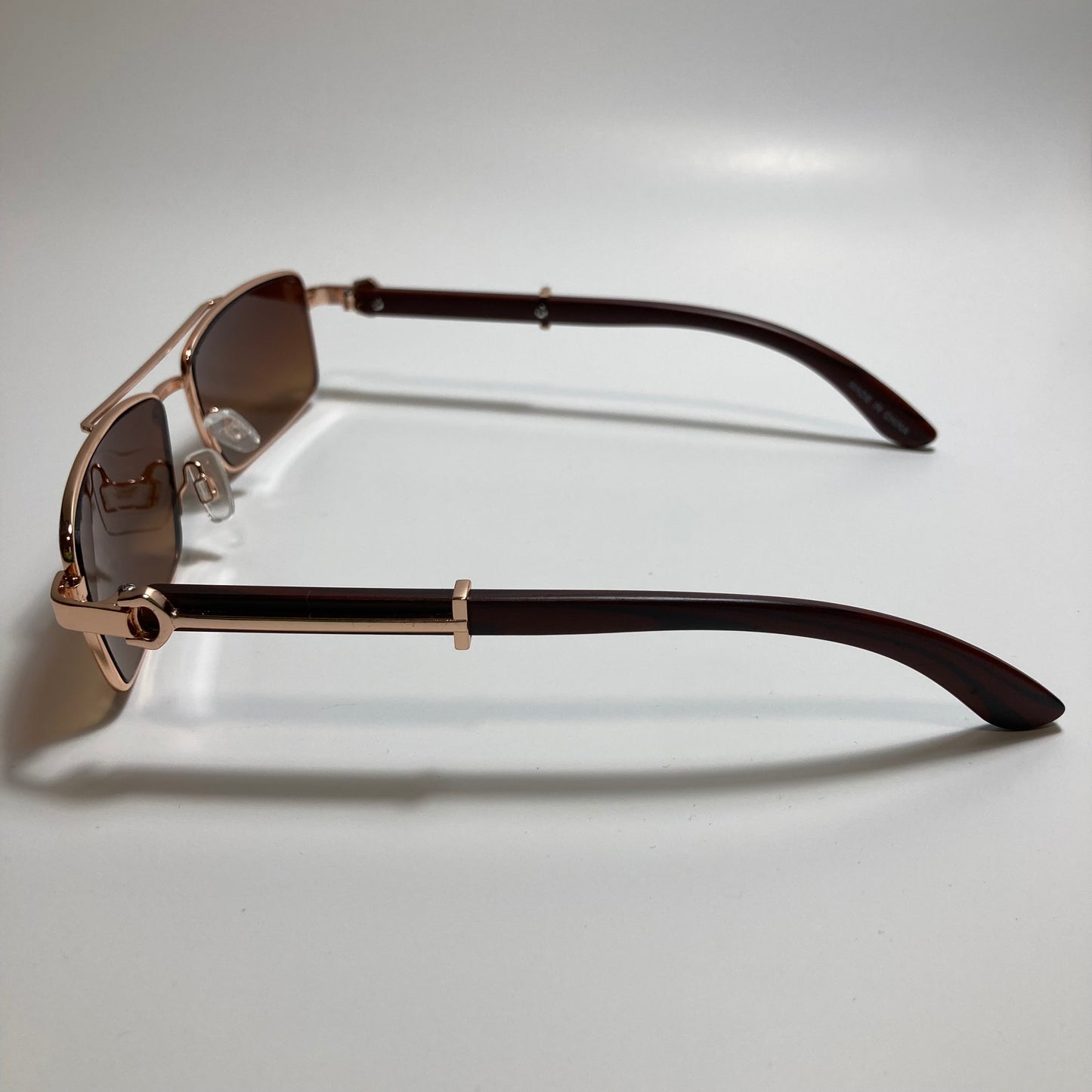 womens and mens brown and gold square metal sunglasses