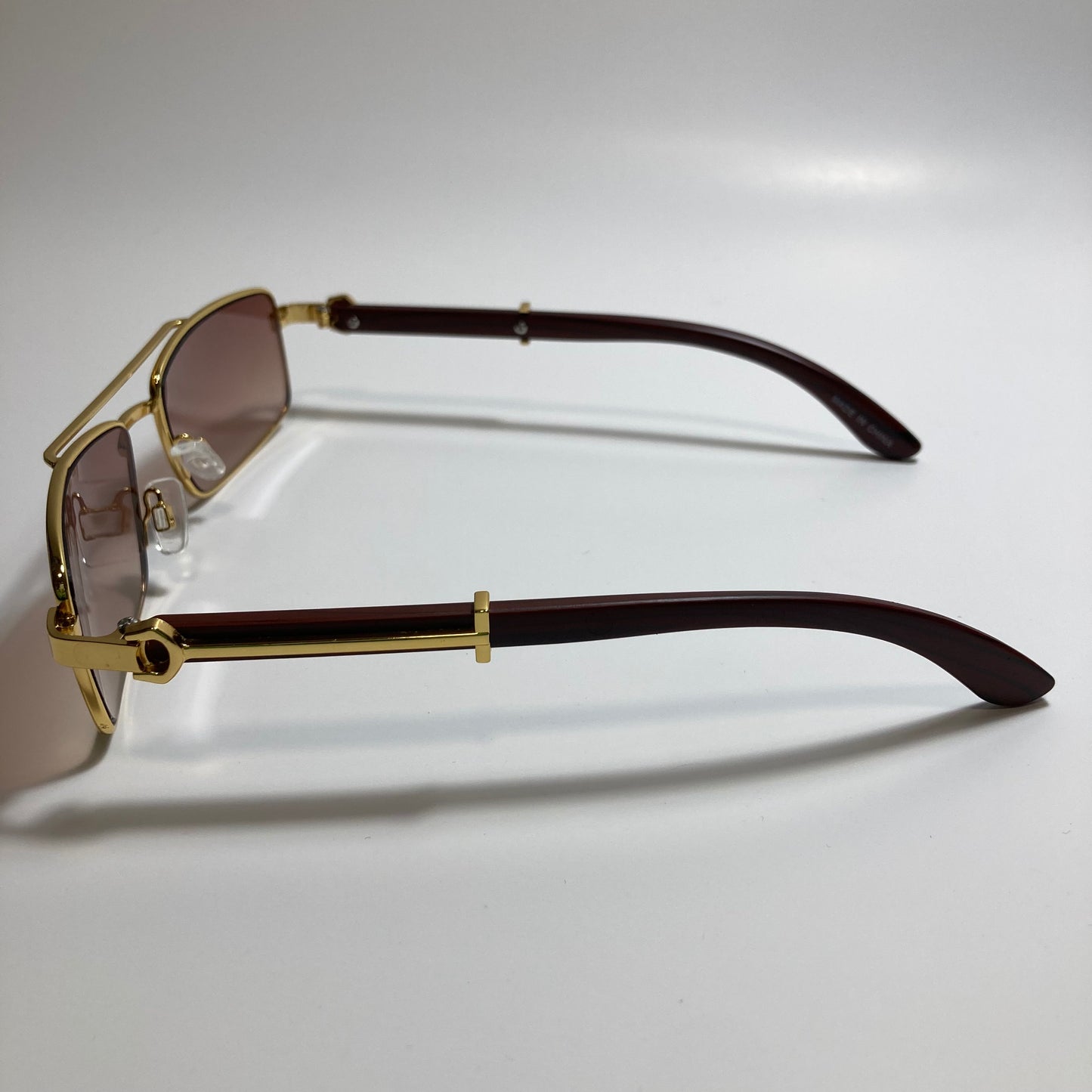 womens and mens brown and gold square metal sunglasses
