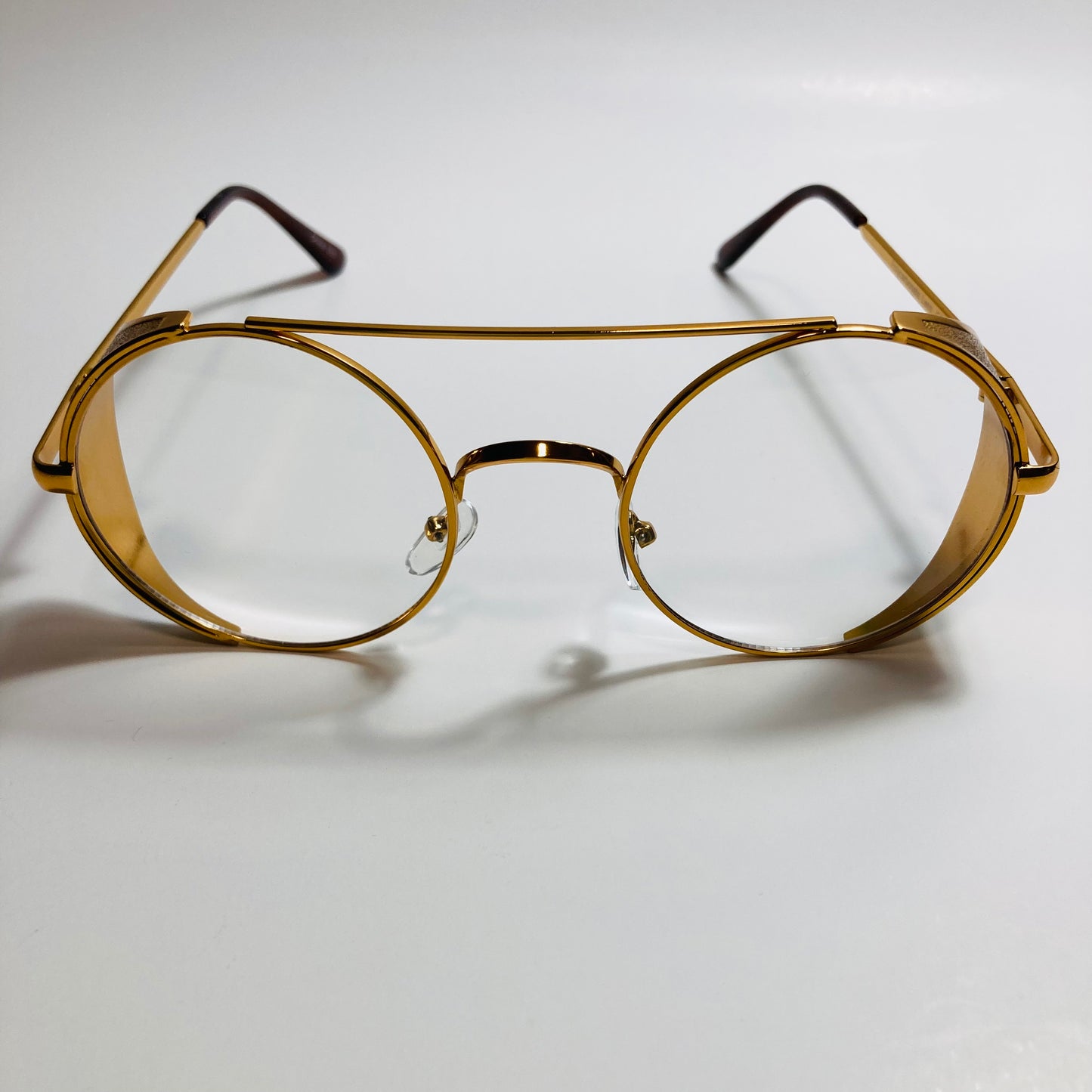 mens and womens gold round glasses with side shields