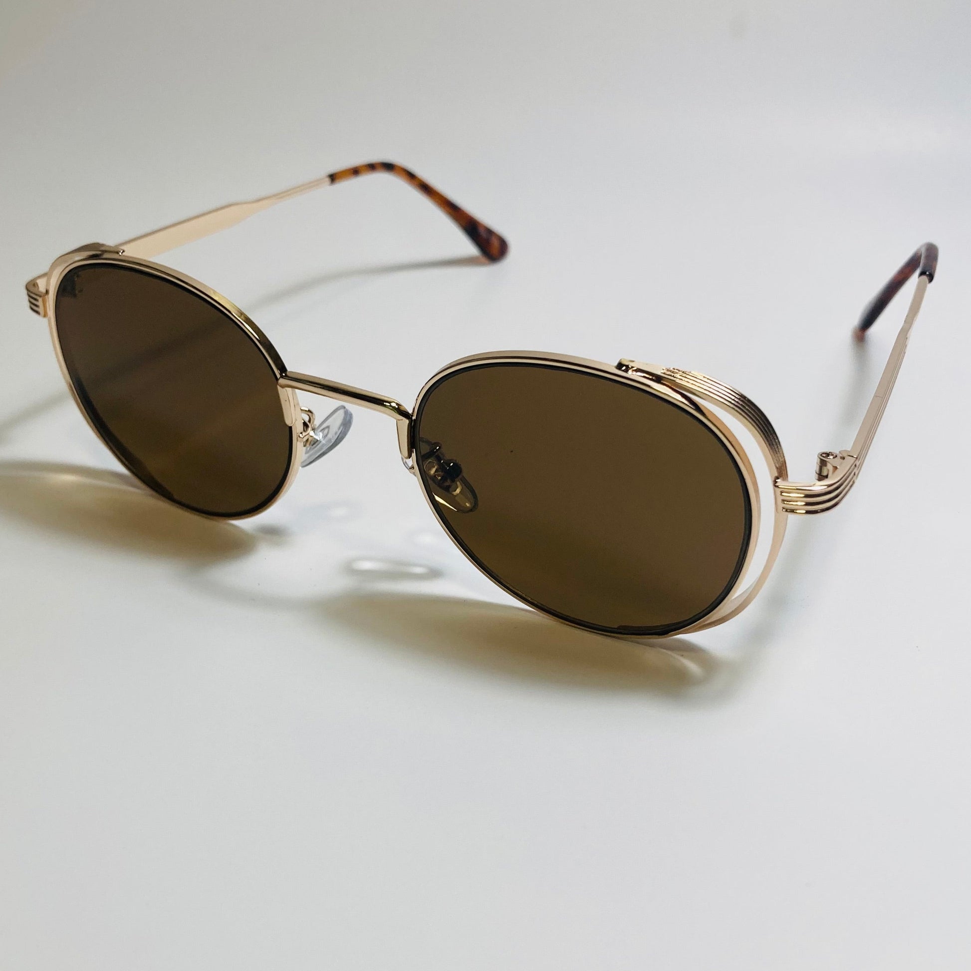 mens and womens gold and brown metal frame side shield y2k sunglasses