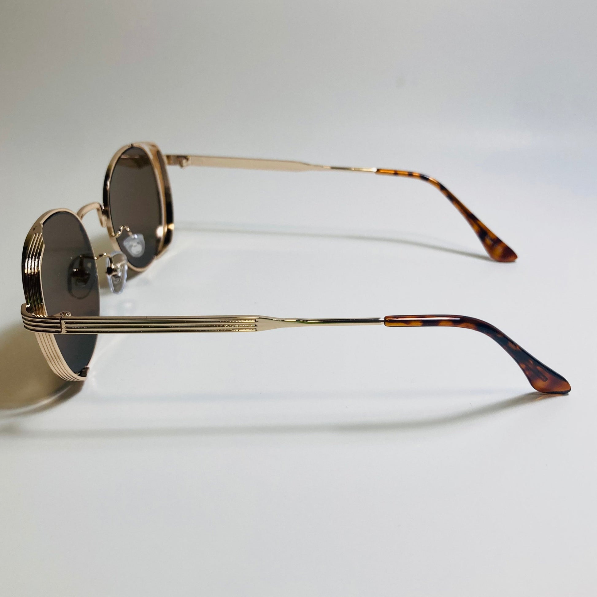 mens and womens gold and brown metal frame side shield y2k sunglasses