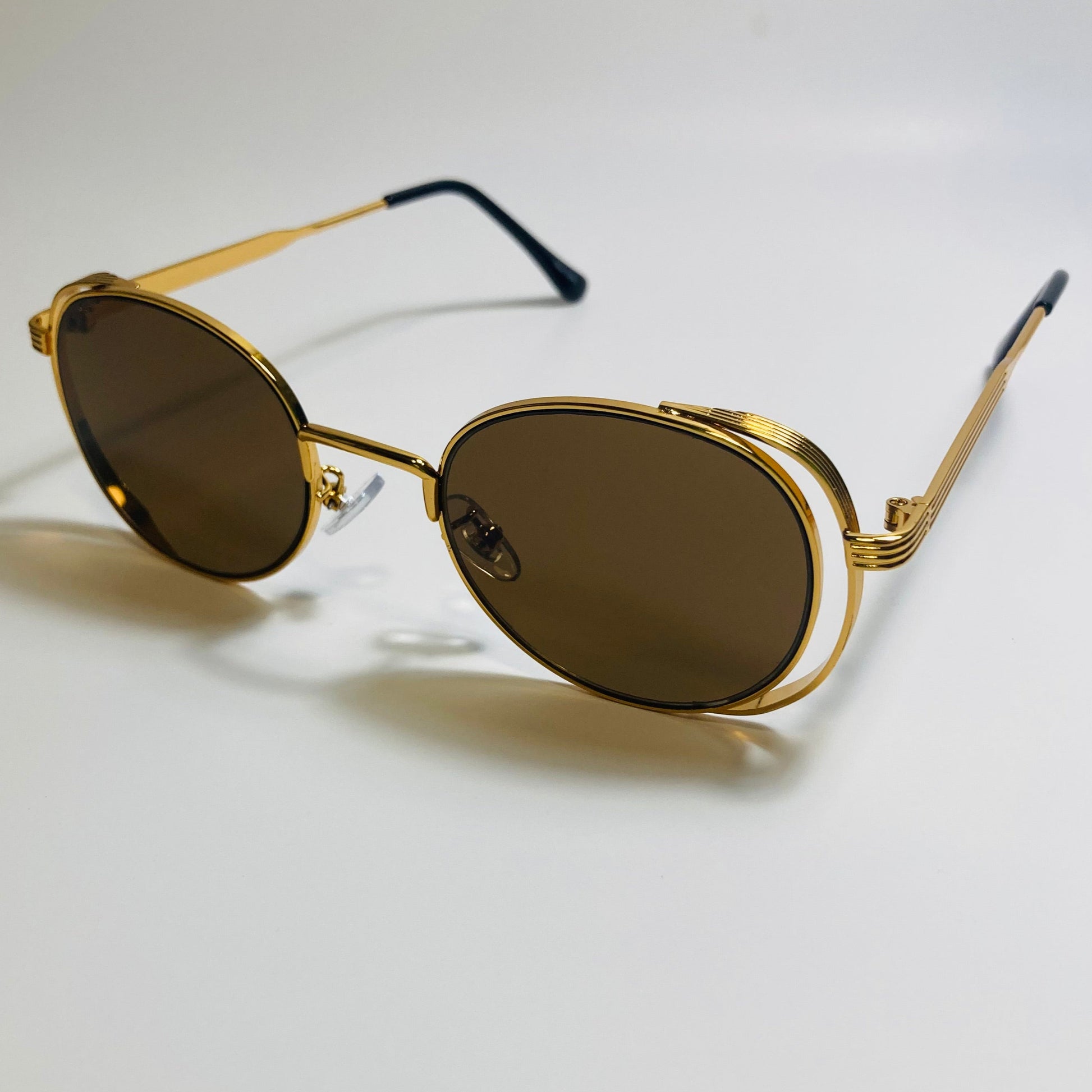 mens and womens gold and brown metal frame side shield y2k sunglasses
