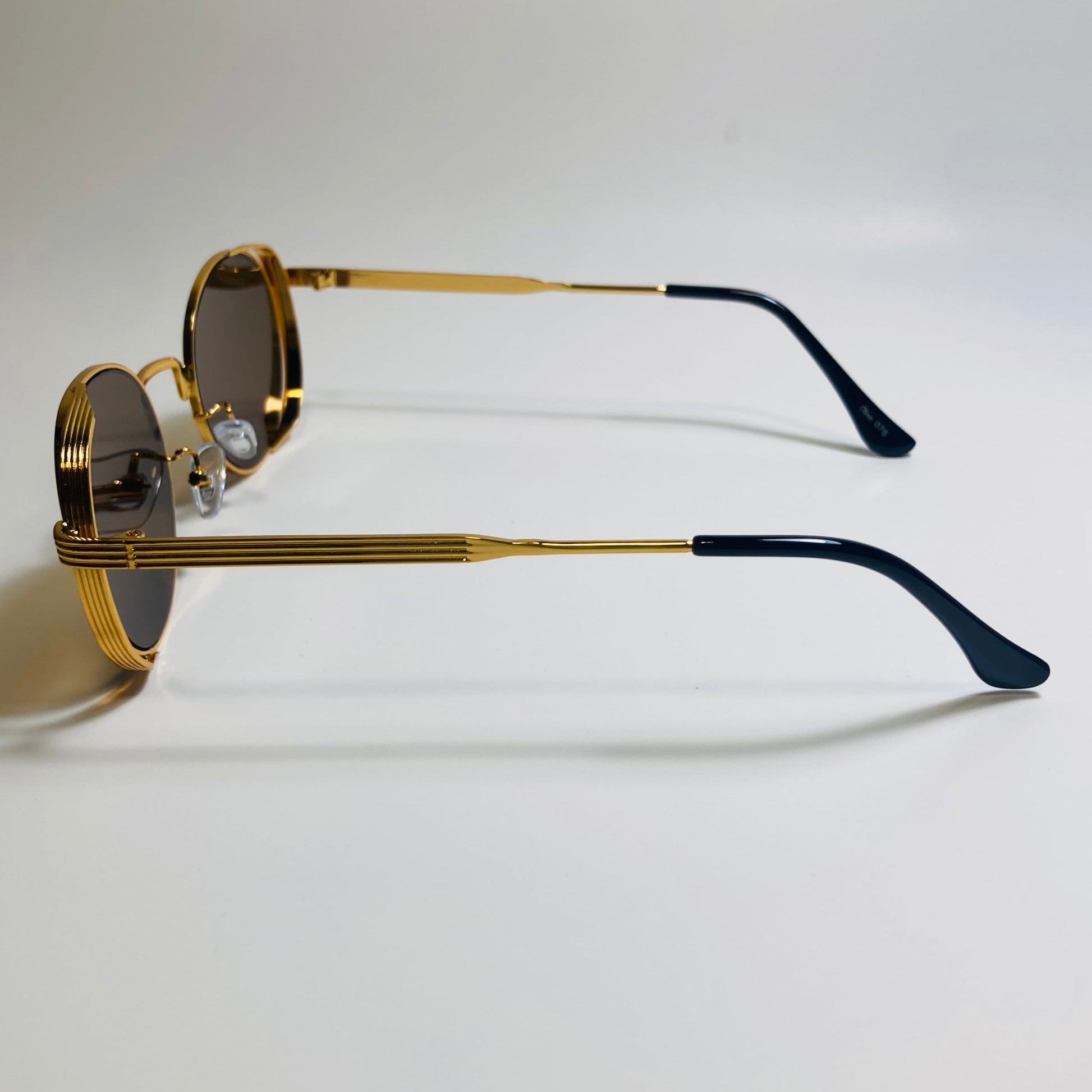 mens and womens gold and brown metal frame side shield y2k sunglasses