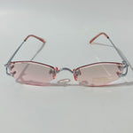 mens and womens silver and pink small rimless sunglasses