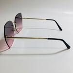 womens black and pink oversize rimless sunglasses