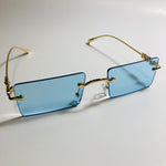 gold rimless womens sunglasses with blue lenses and flower accent