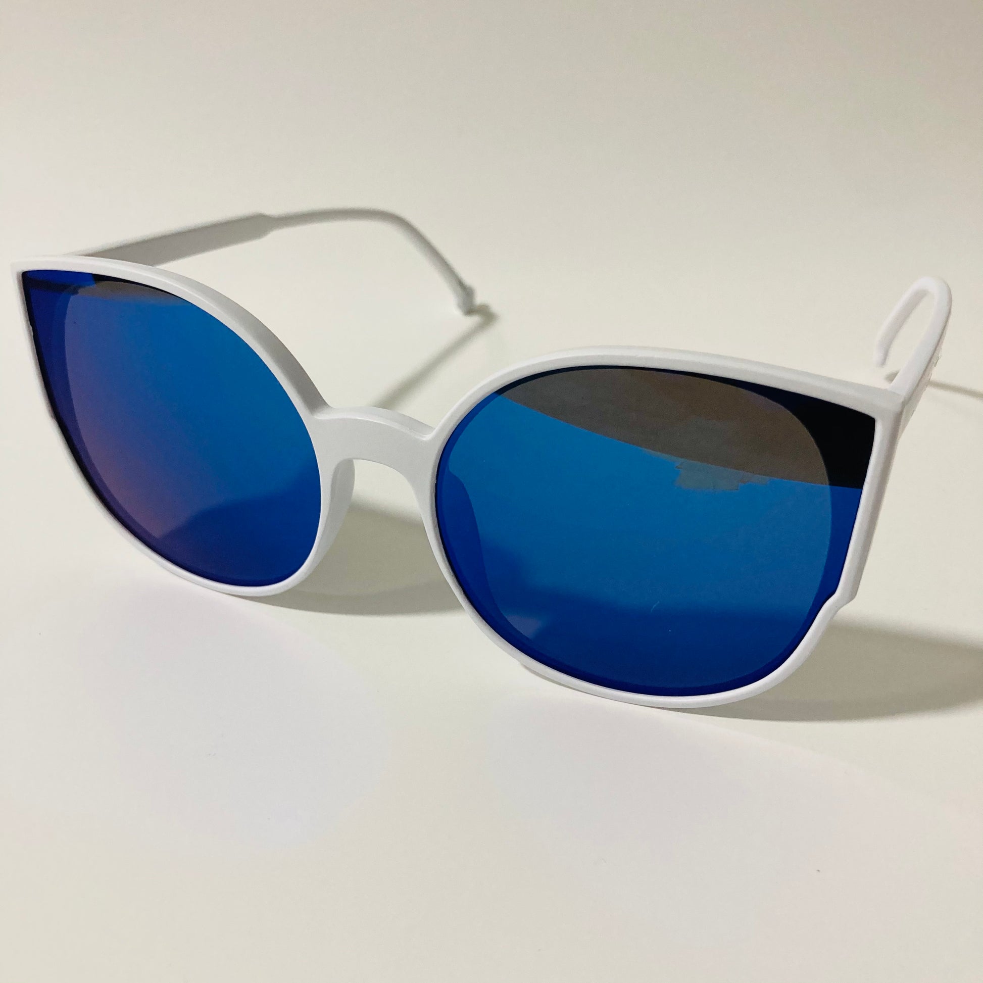 womans white and blue mirrored cat eye sunglasses