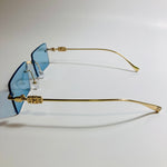 gold rimless womens sunglasses with blue lenses and flower accent