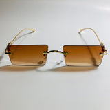 gold rimless womens sunglasses with brown lenses and flower accent
