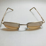 mens and womens brown and gold small square sunglasses