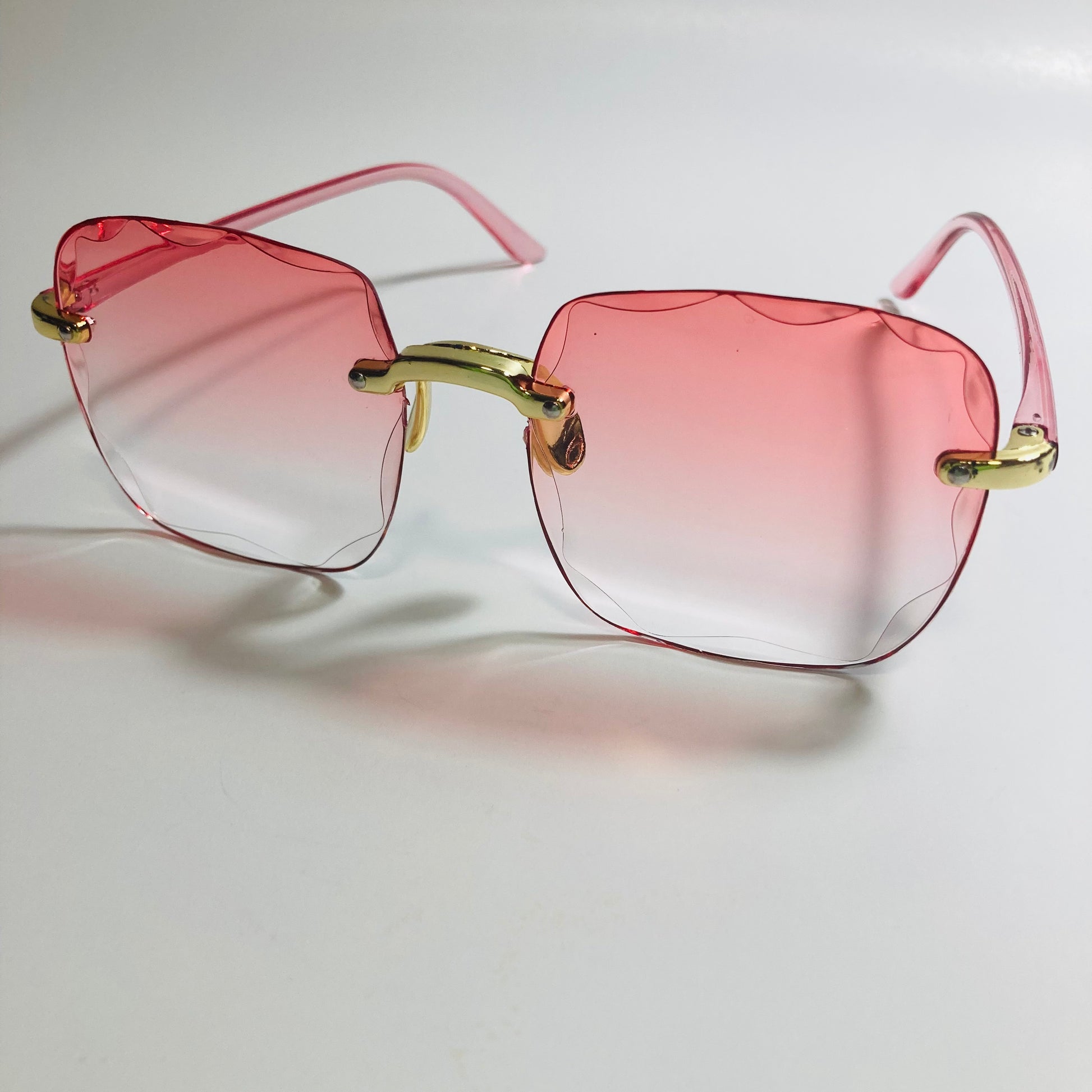 womens rimless gold square oversize sunglasses with pink lenses