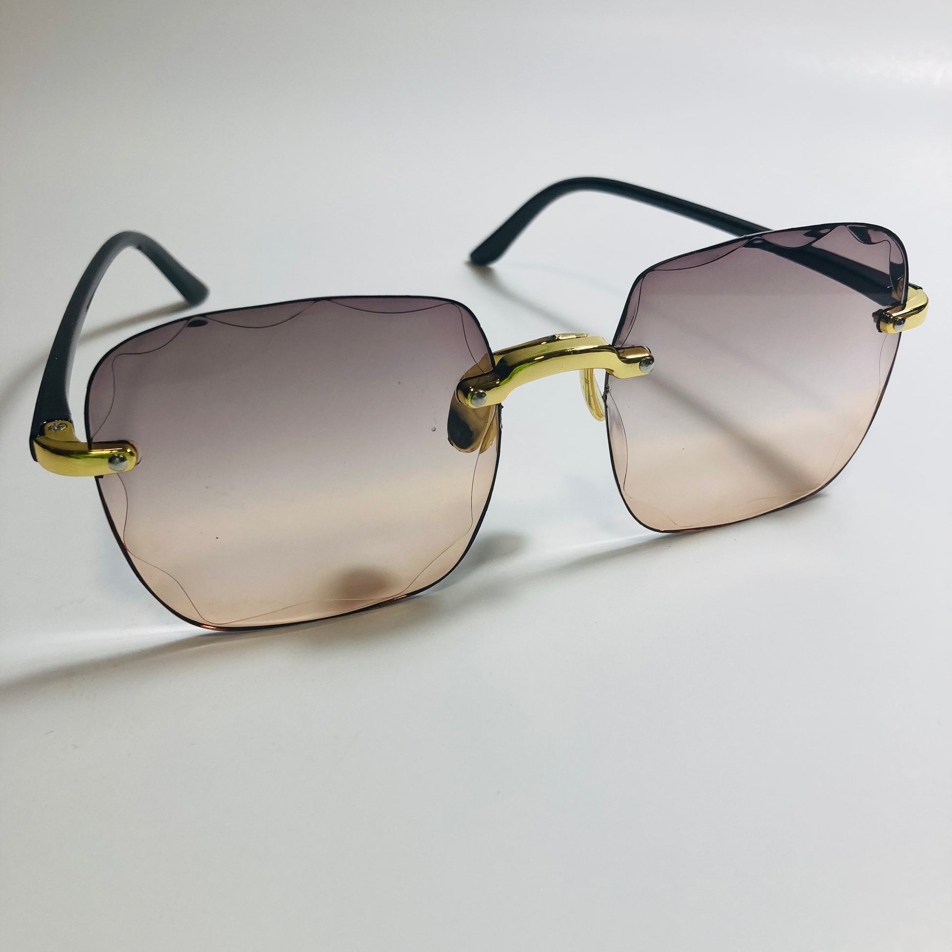 womens rimless gold square oversize sunglasses with black and brown lenses