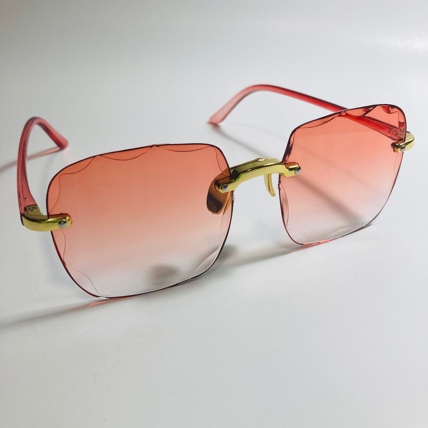 womens rimless gold square oversize sunglasses with red lenses