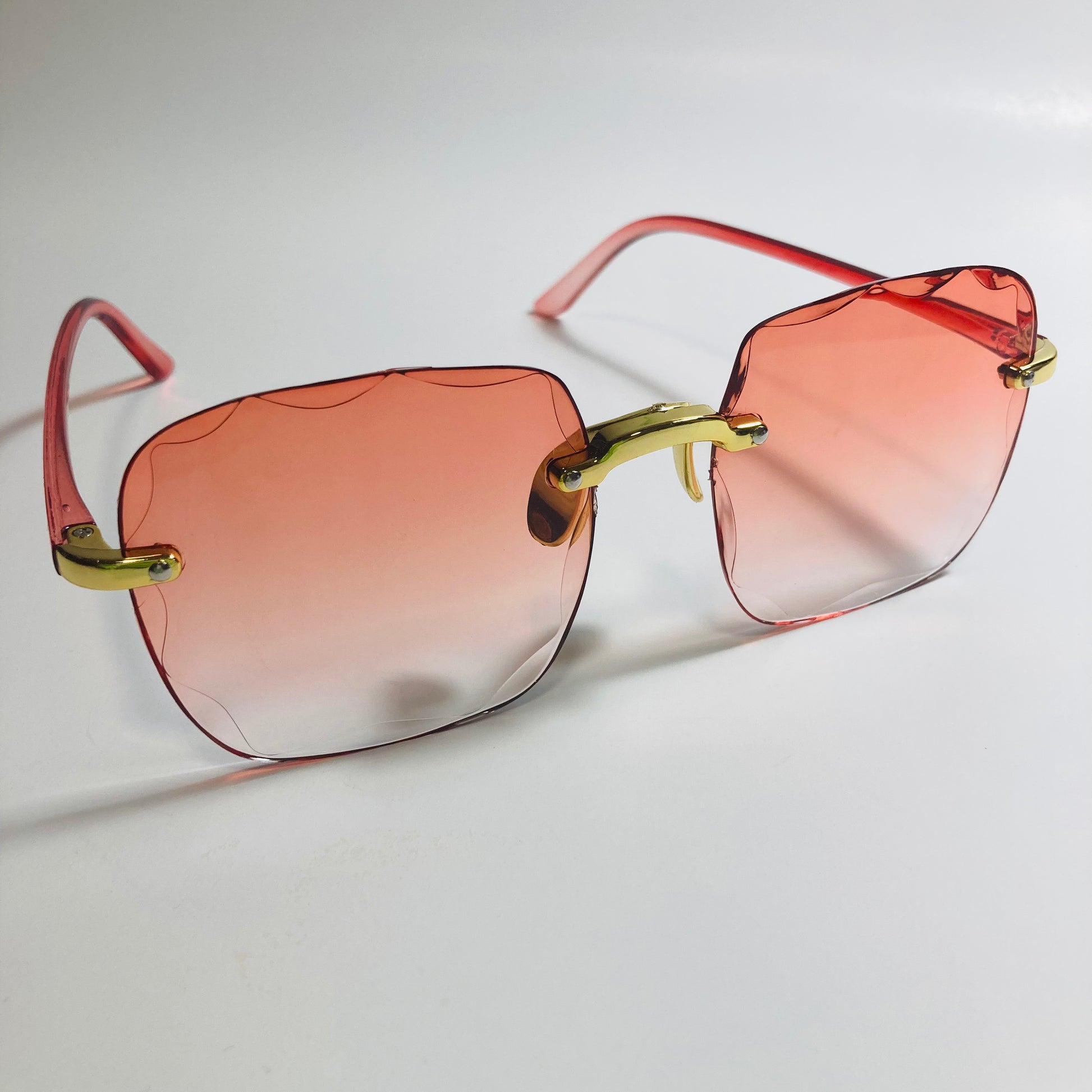 womens rimless gold square oversize sunglasses with red lenses