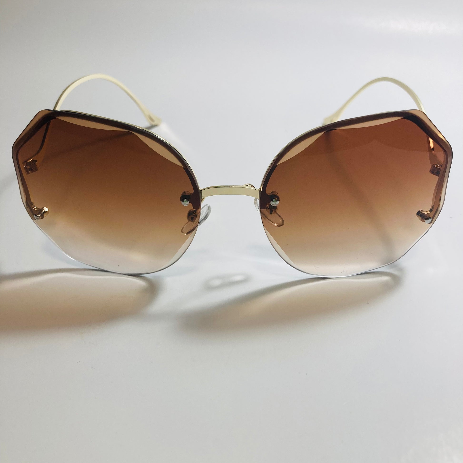 womens brown and gold rimless sunglasses
