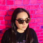 woman wearing black cat eye sunglasses