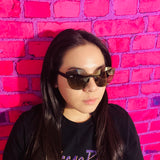 woman wearing black cat eye sunglasses